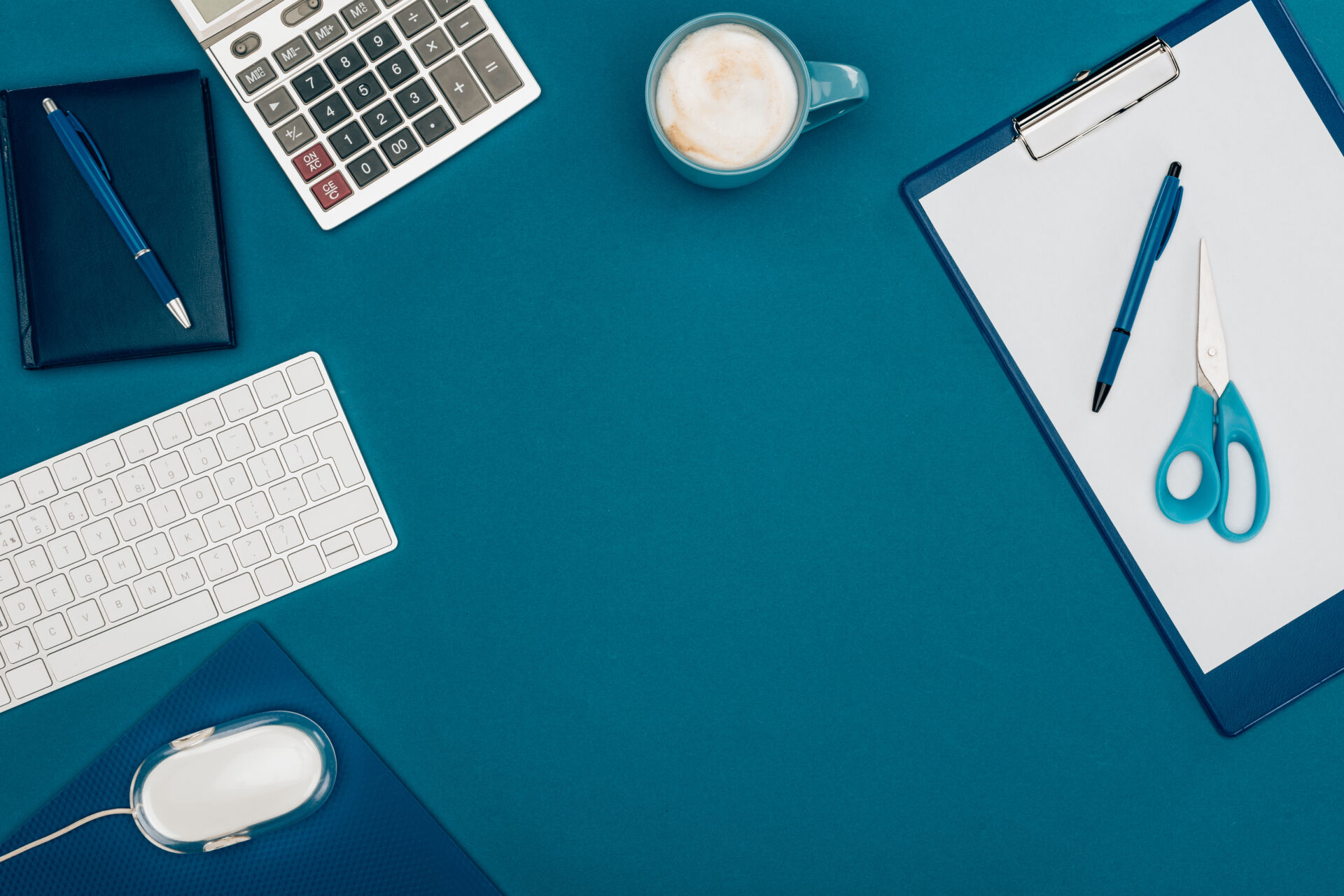 top view of blank clipboard with stationary for insights from chartered accountants in Kent